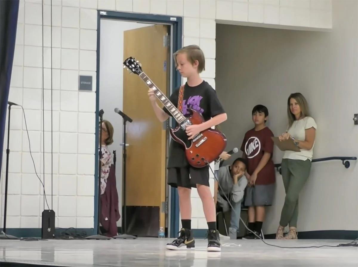 At the school talent contest, 11-year-old Julian jams out to AC/DC.